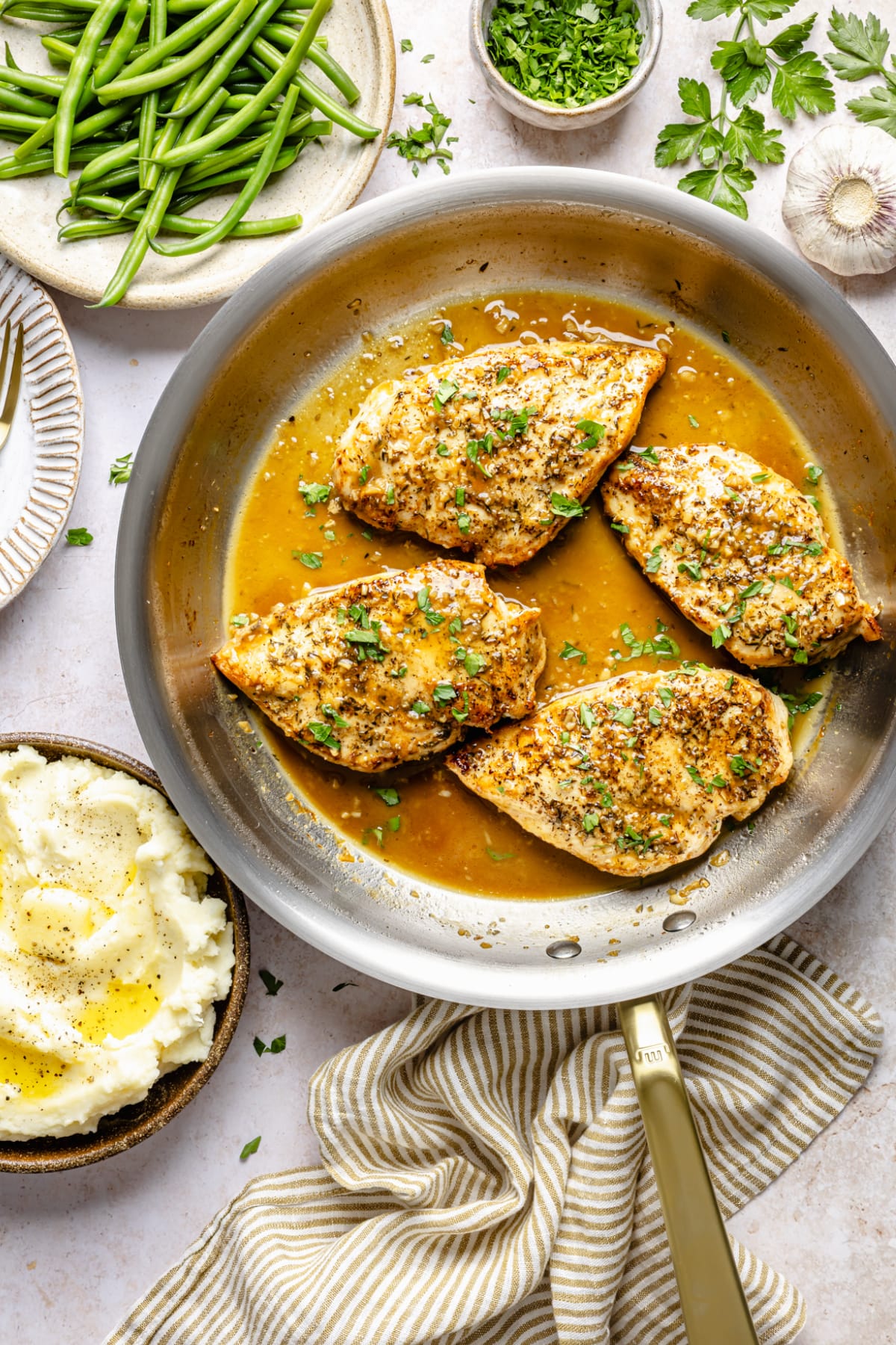 The garlic butter chicken in the pan after it's seared and simmered in the sauce.