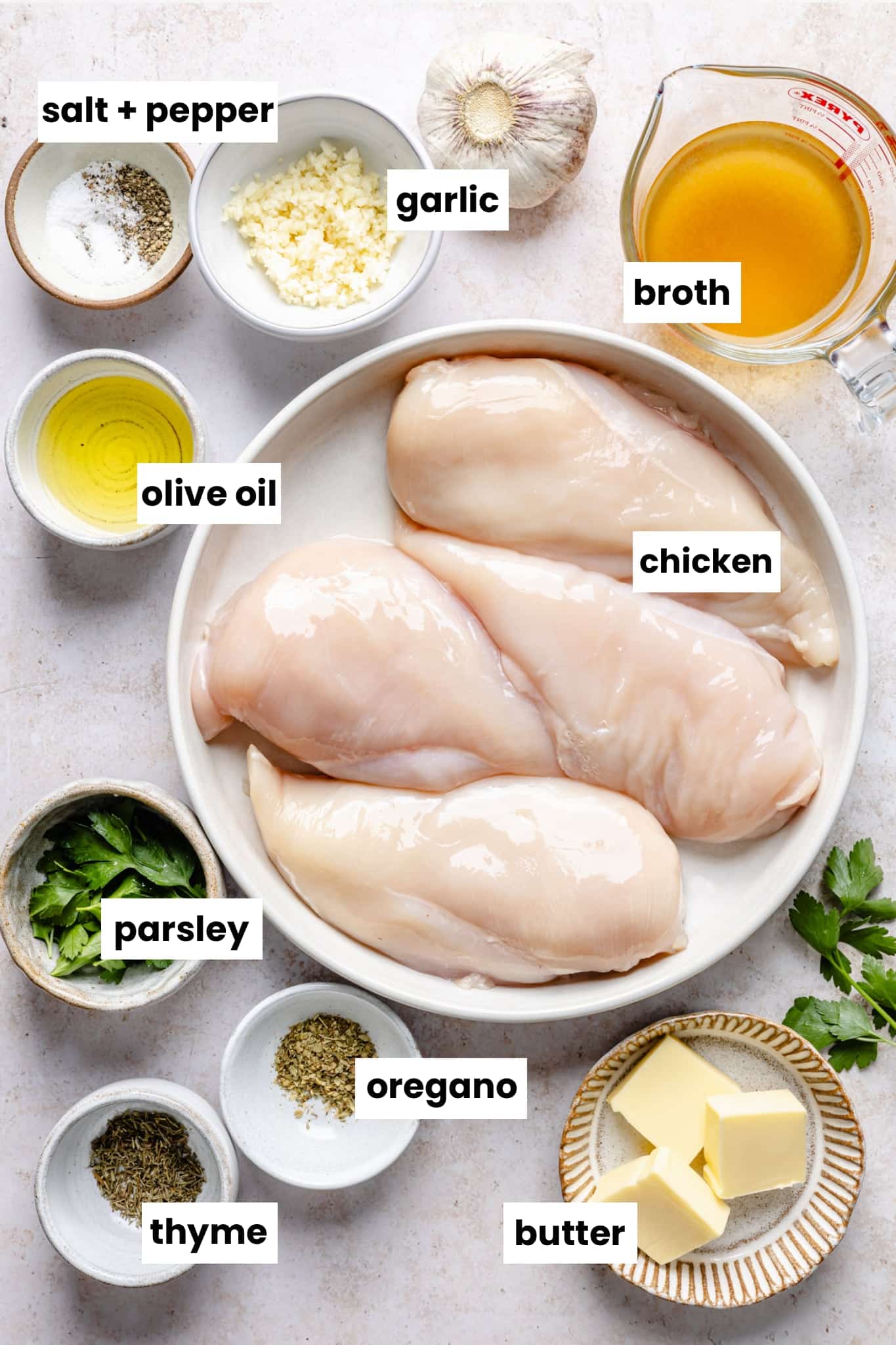 Ingredients in the recipe, including chicken, broth, butter, garlic, olive oil, salt, pepper, thyme, fresh parsley, and oregano.