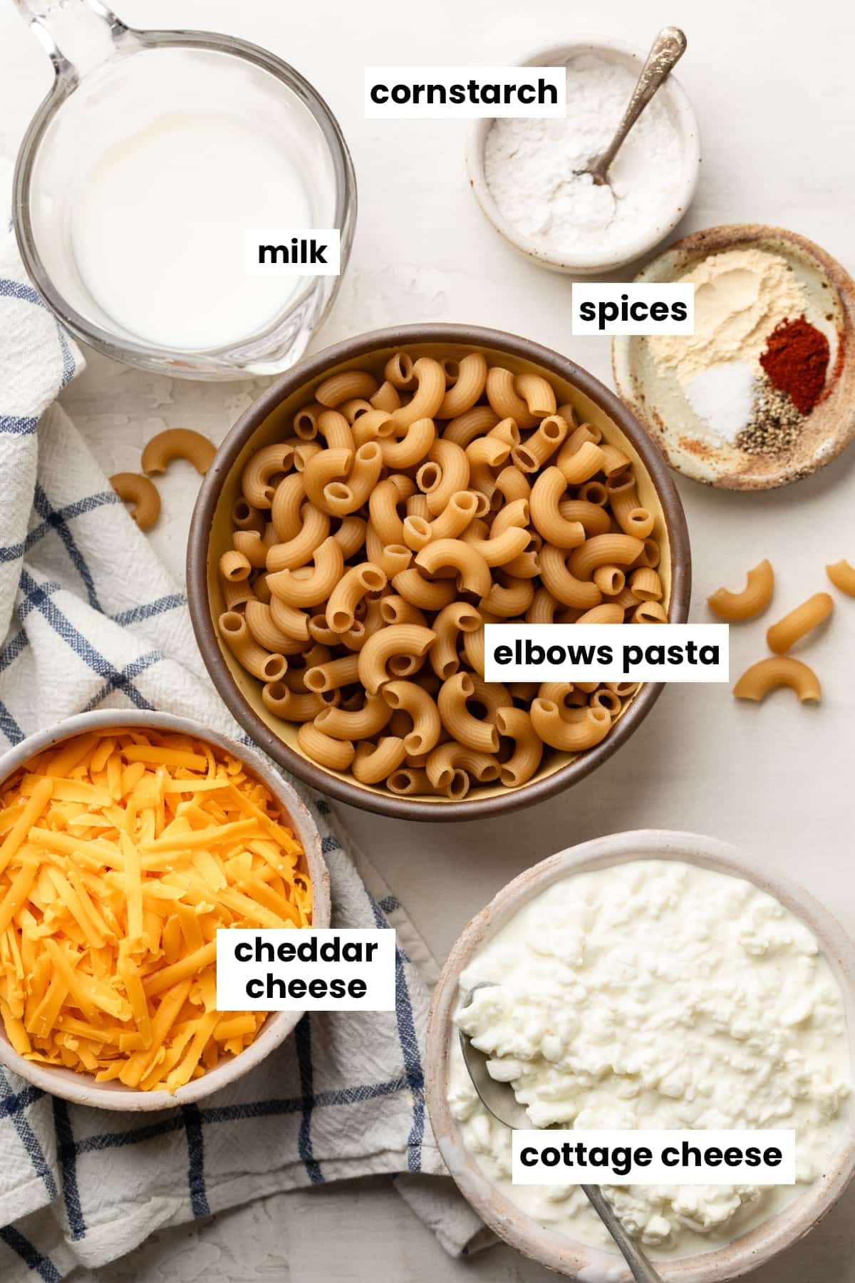 Ingredients in the recipe, including elbows pasta, cottage cheese, cheddar cheese, milk, cornstarch, garlic, sea salt, paprika, and black pepper.