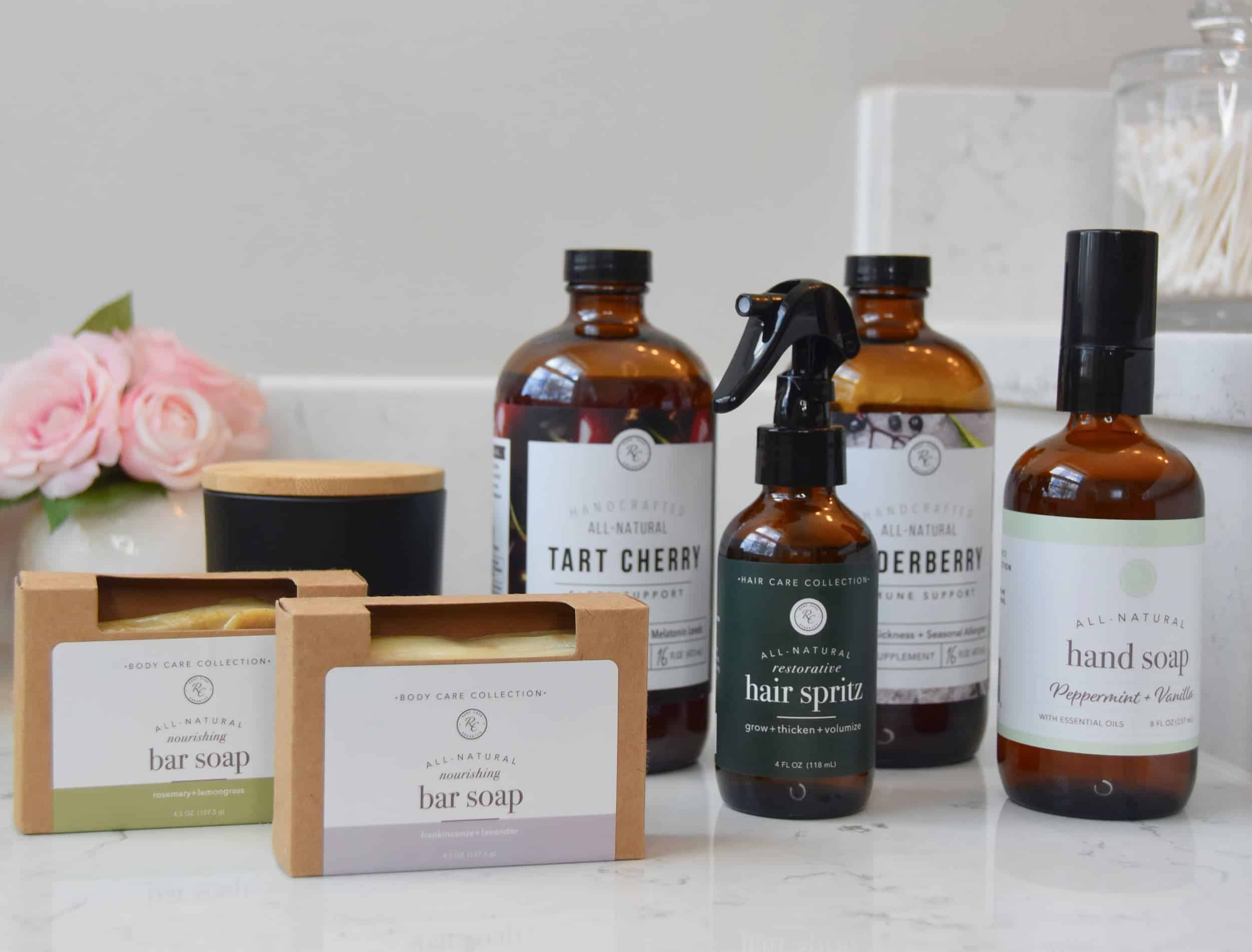 All of the Rowe Casa Organics products included in the review on a bathroom countertop with a vase in the background.