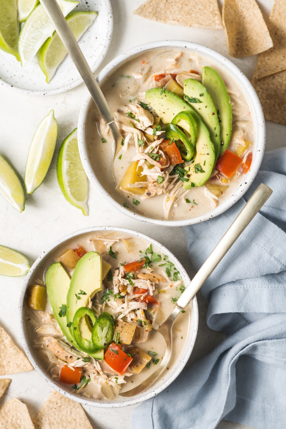 overhead shot of two bowls of paleo white chicken chili