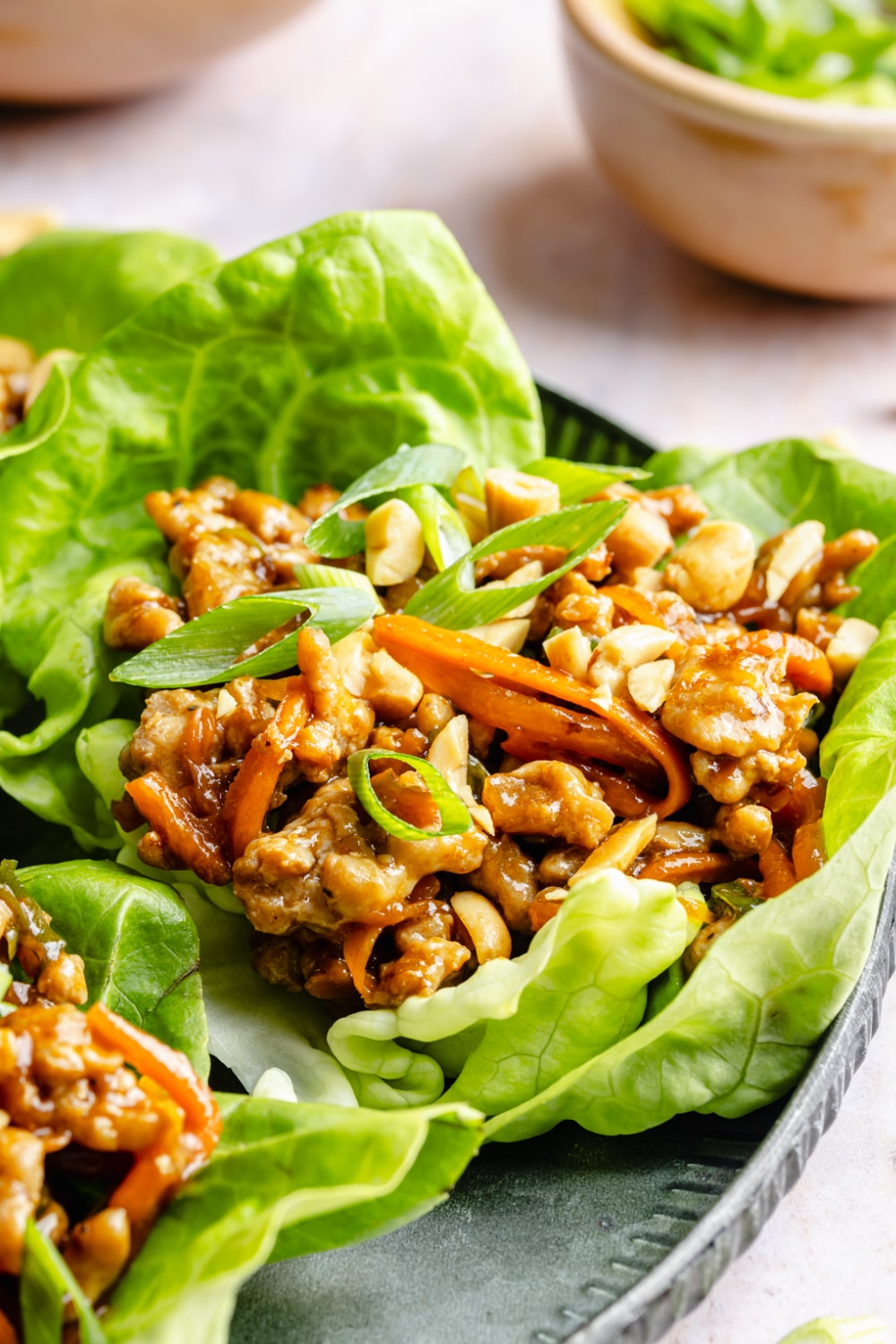 Close up of the ground chicken filling in butter lettuce.
