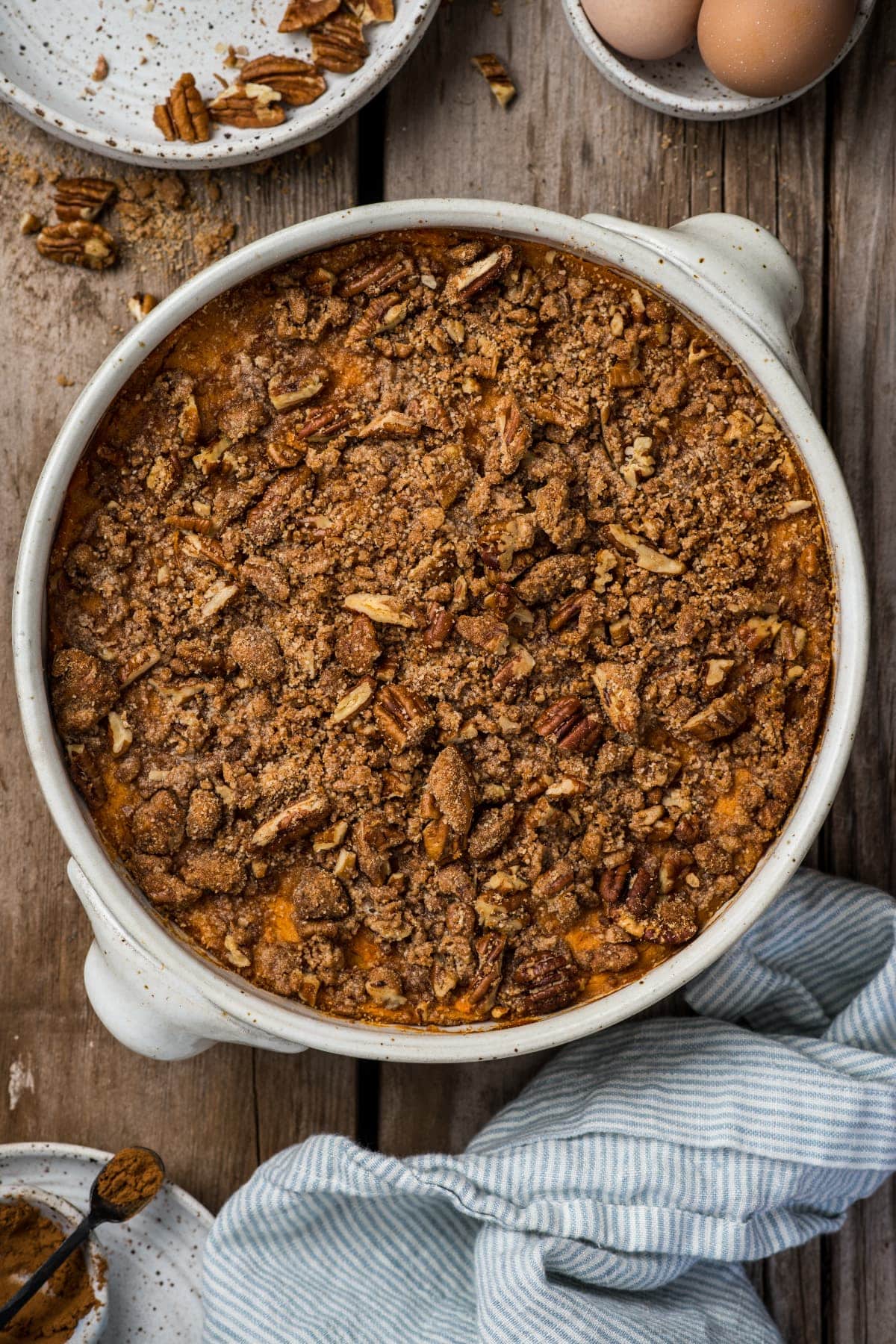 The entire casserole in a round baking dish on the table with a napkin.