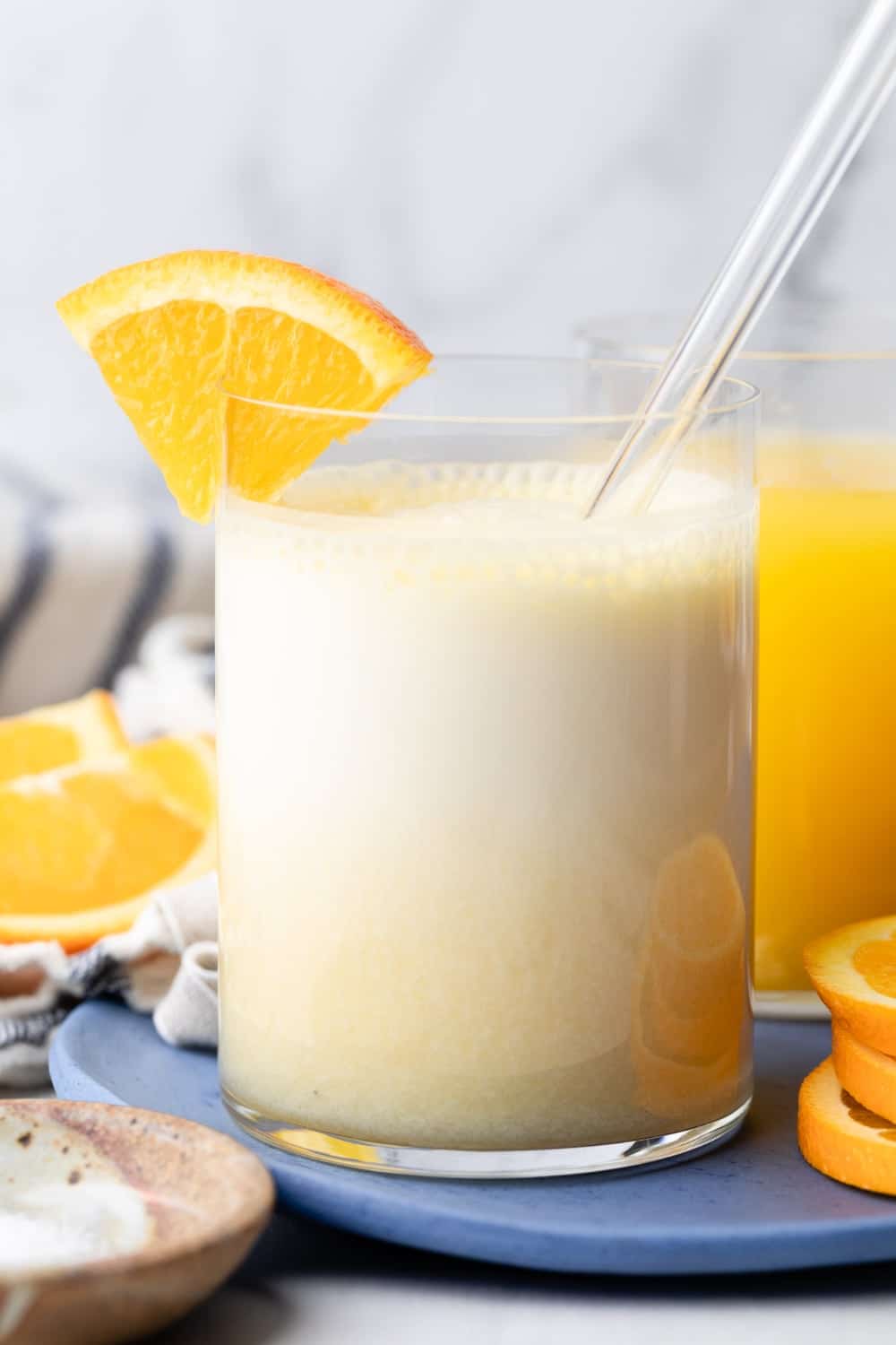 An orange creamsicle adrenal cocktail blended in a small glass.