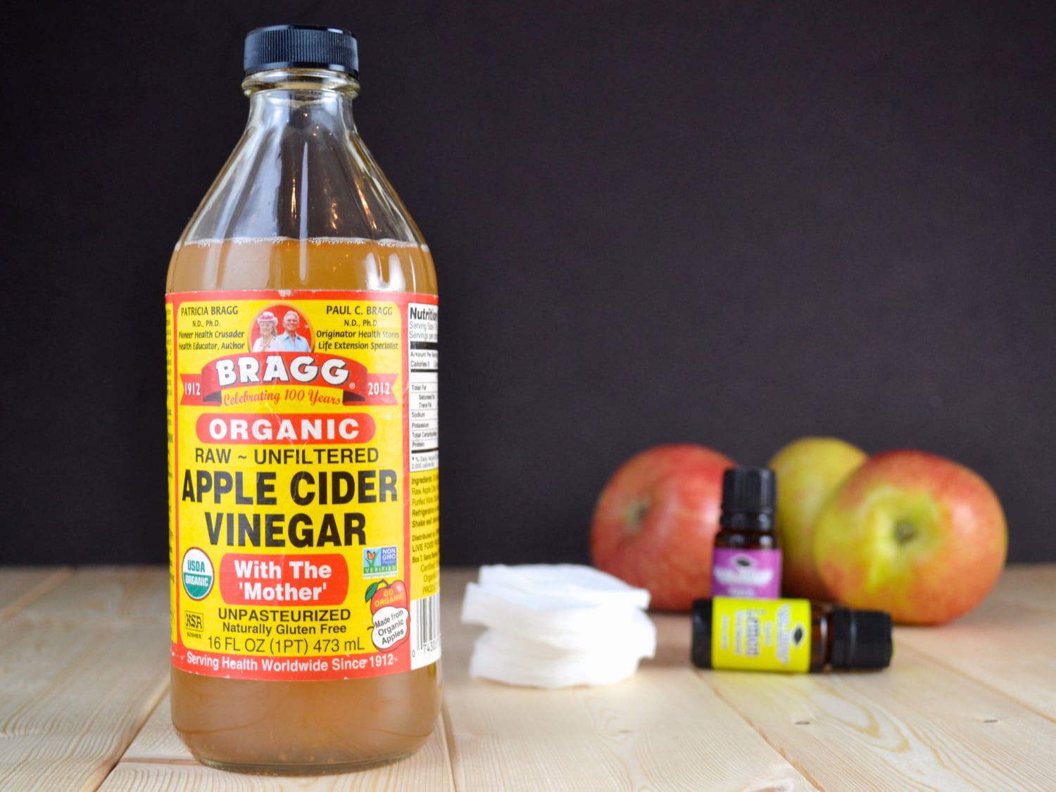 a bottle of apple cider vinegar with ingredients to make a toner