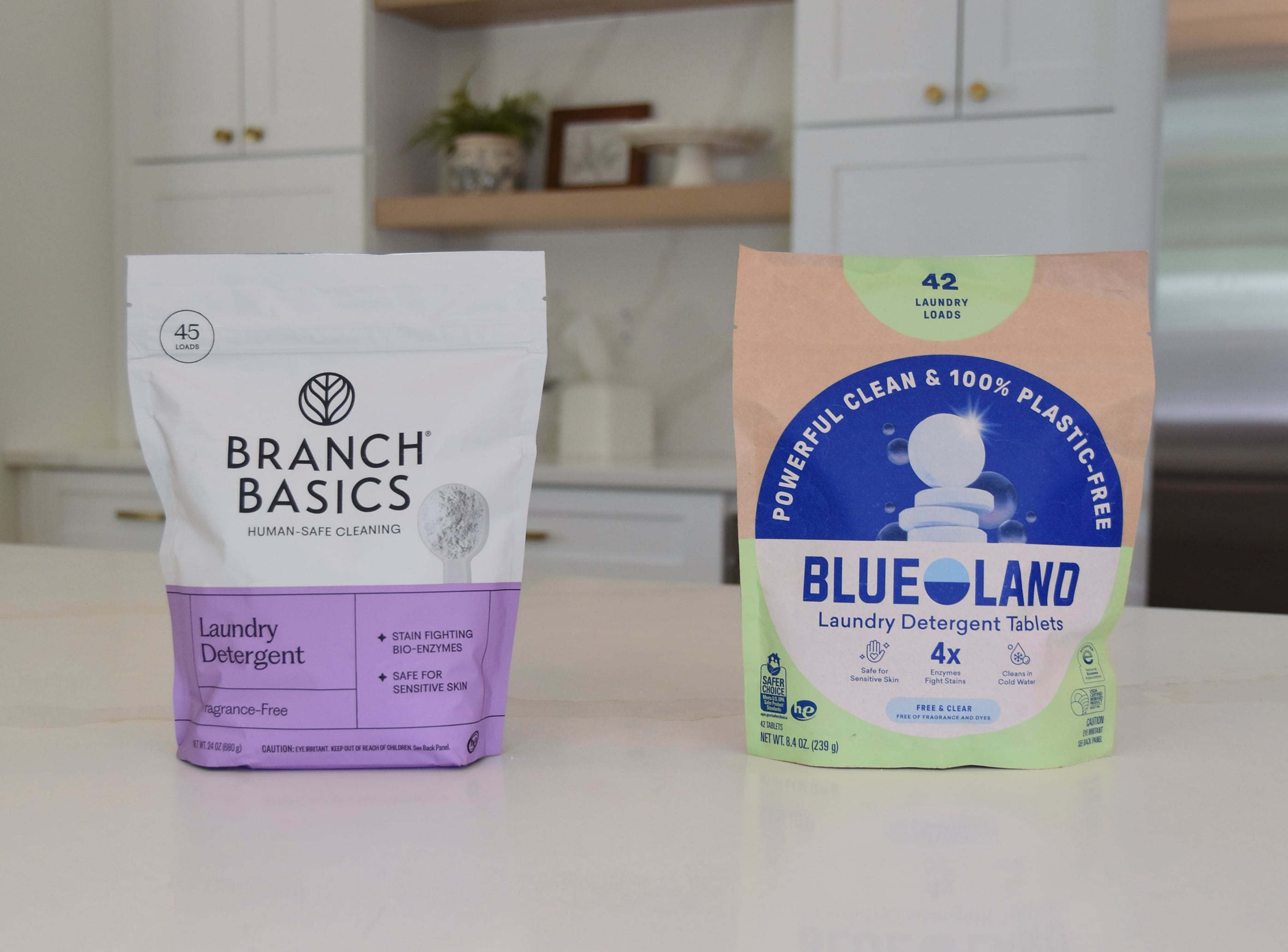 The Branch Basics laundry detergent on the counter compared to Blueland laundry detergent tablets.