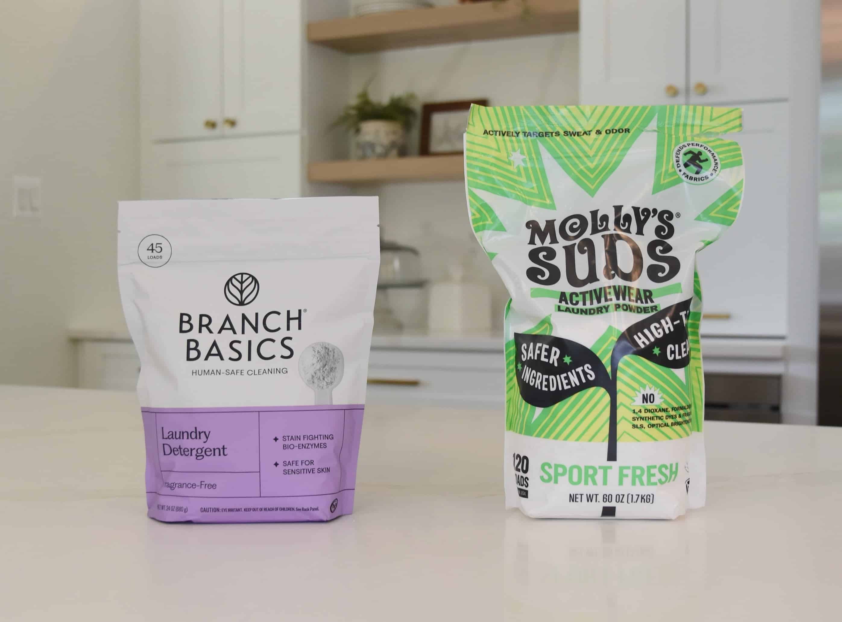 Showing the Branch Basics Laundry Detergent vs the Molly's Suds laundry powder.