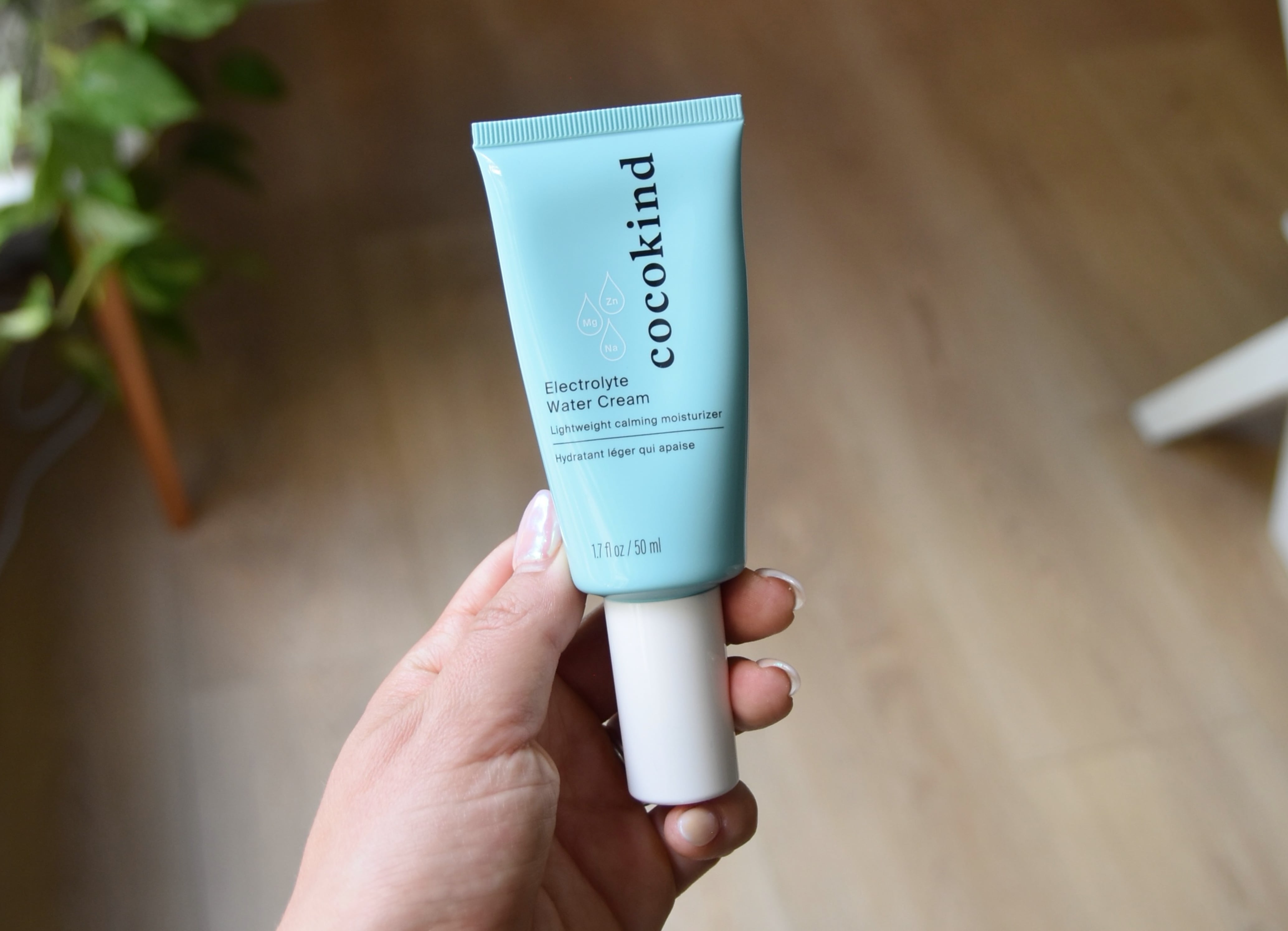 Holding the Electrolyte Water Cream product.