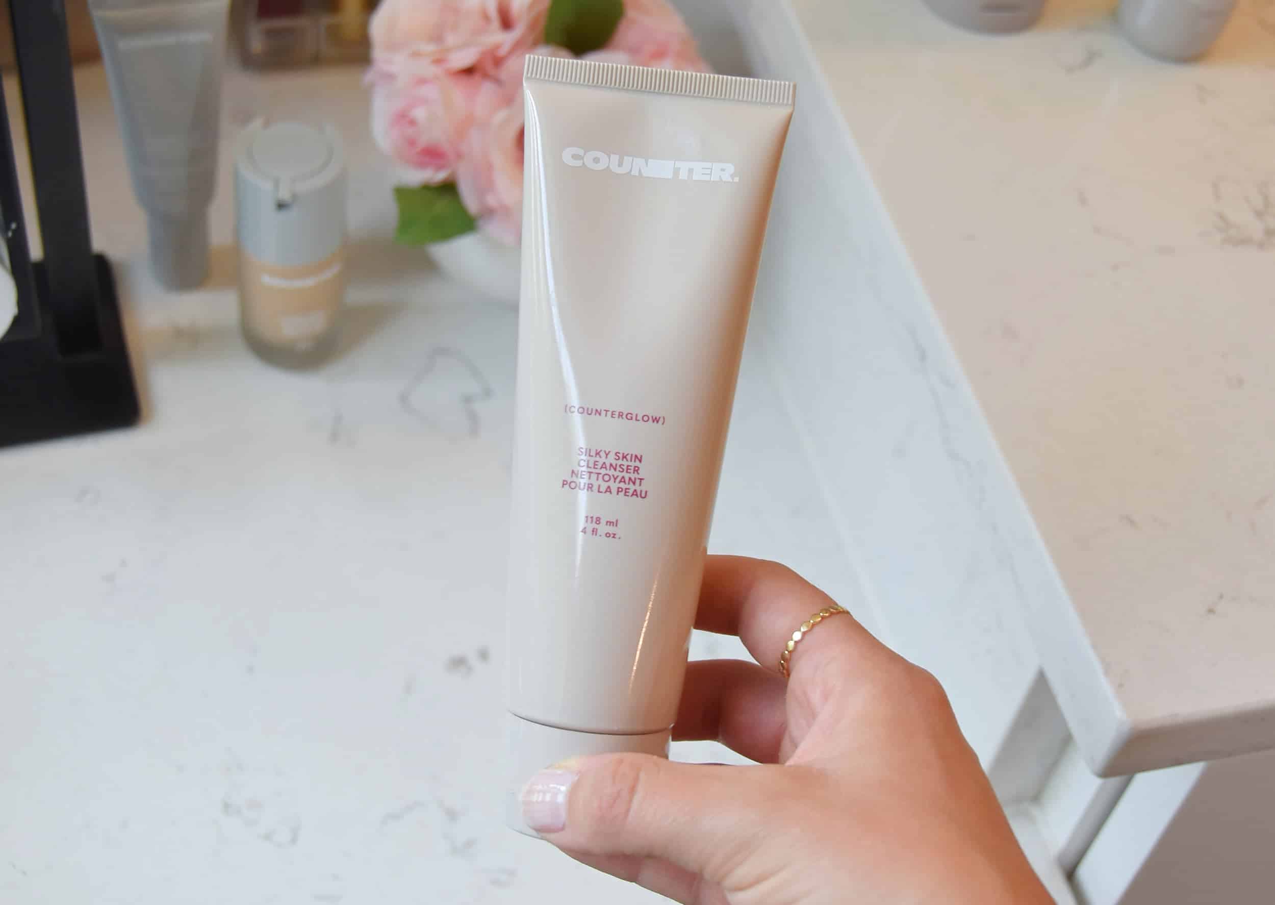 Holding the new Counterglow Silky Skin Cleanser, which replaced Beautycounter's old Countermatch cleanser.