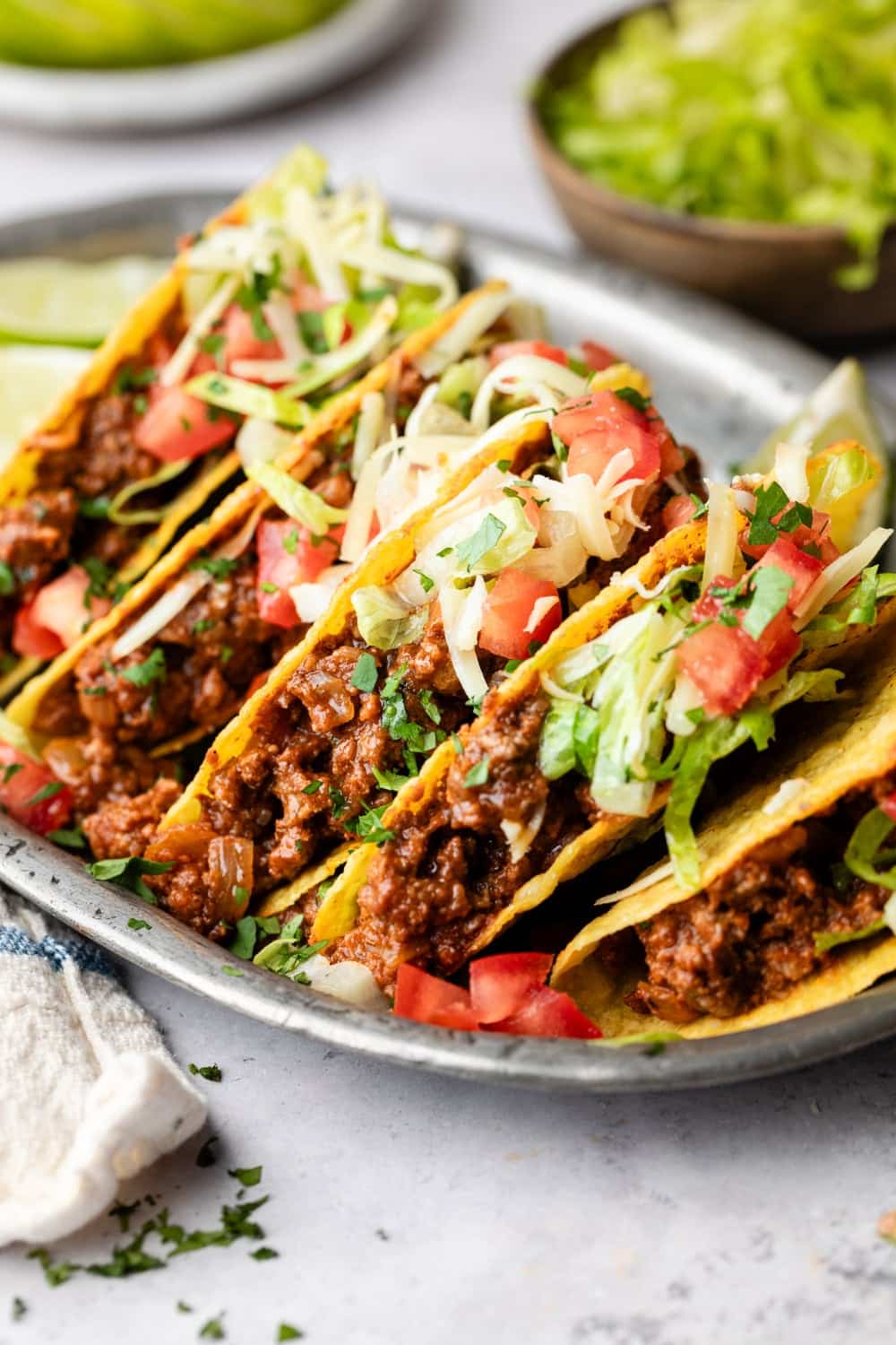 The ground beef mixture served in hard taco shells with tomatoes, lettuce, and cheese.