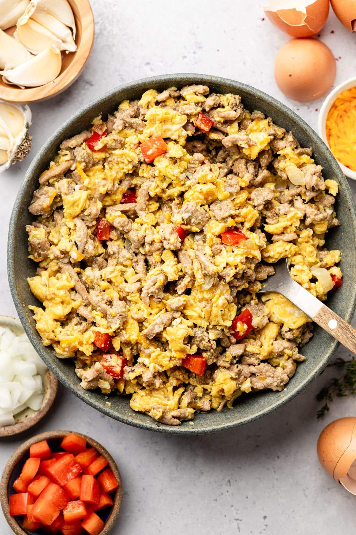 Cooking the filling for the burritos—veggies, eggs, and ground turkey—in a pan.