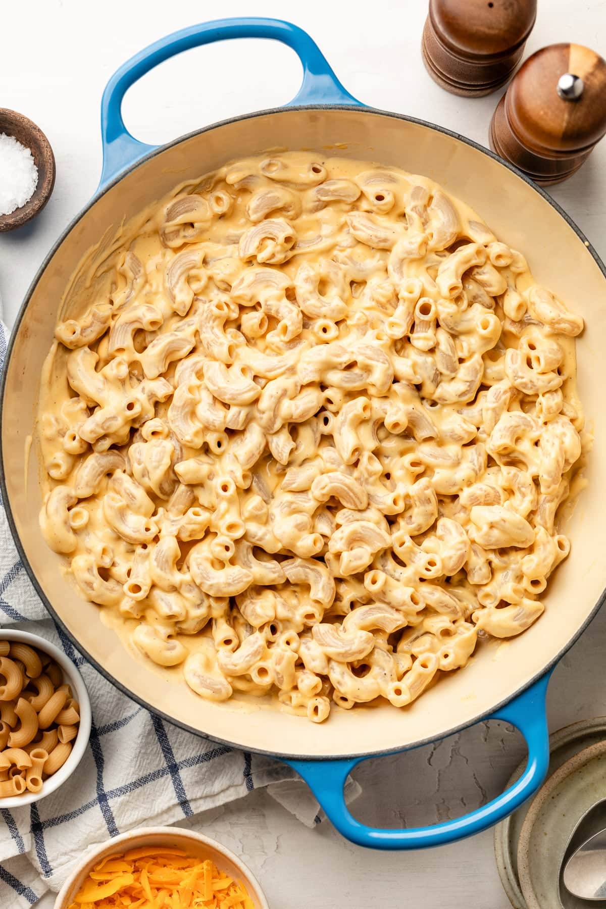 High protein mac and cheese in a sauce pan with cheese sauce mixed in.