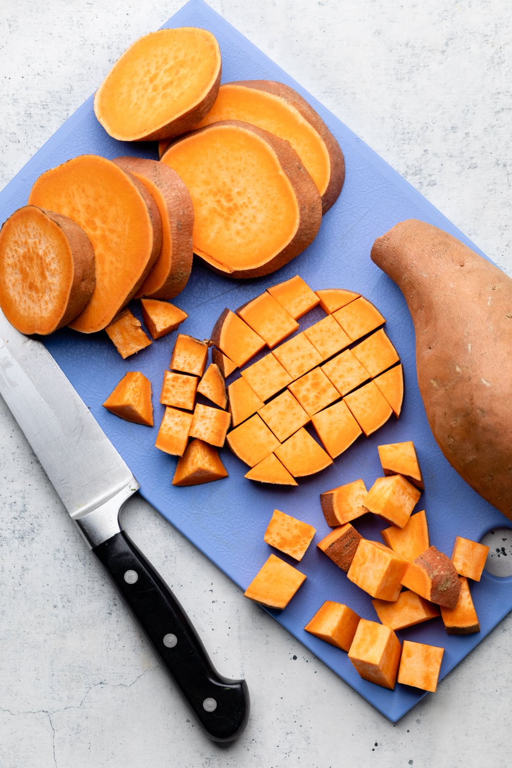How to cut sweet potatoes into even cubes.
