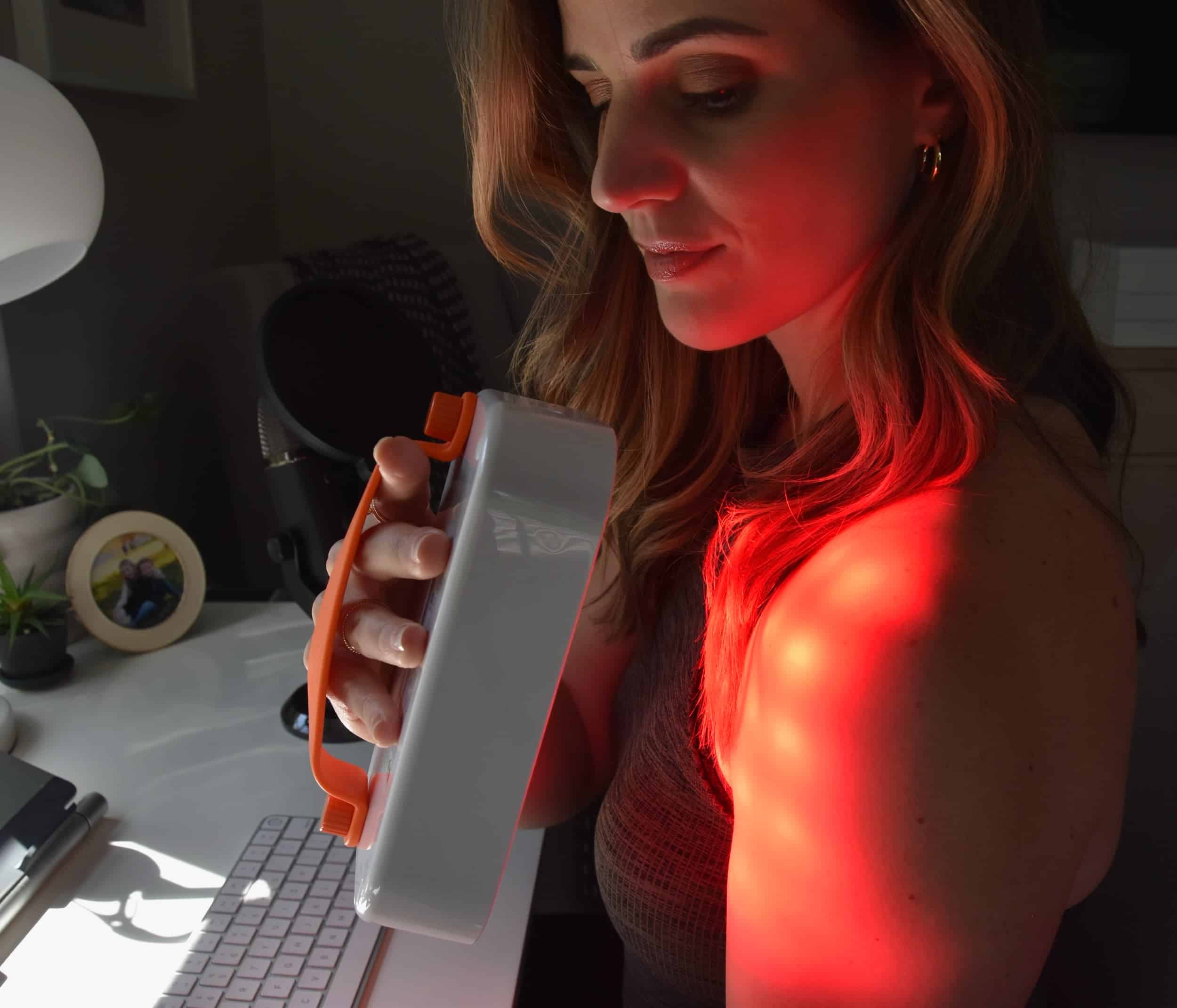 Showing how to use the Lumebox red light therapy device on my the shoulder with it on.