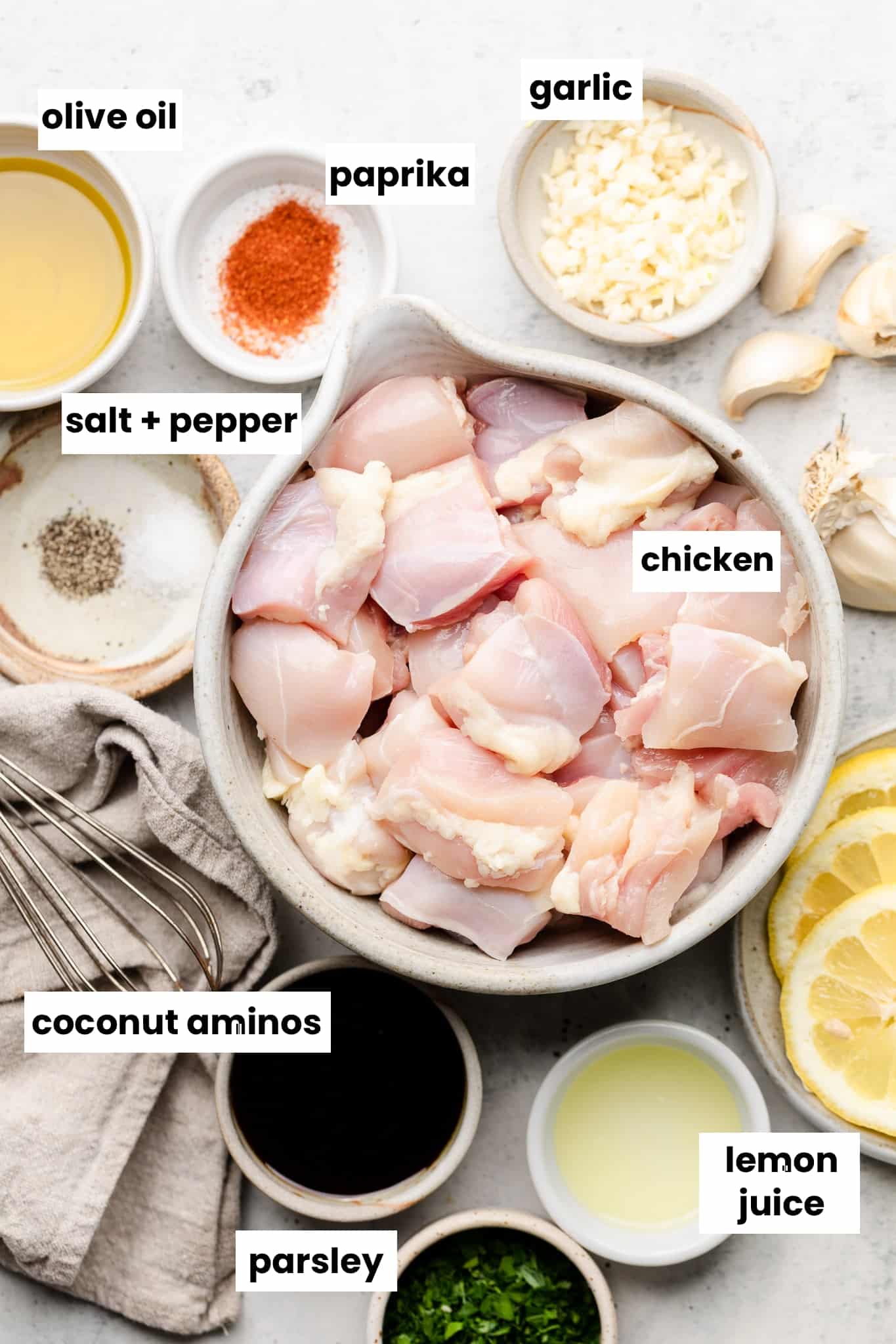 Ingredients in this recipe including chicken, lemon juice, coconut aminos, salt, pepper, paprika, parsley, olive oil, and garlic.