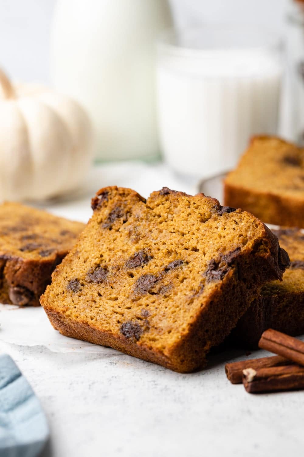 close up of a slice of paleo pumpkin bread with chocolate chips.