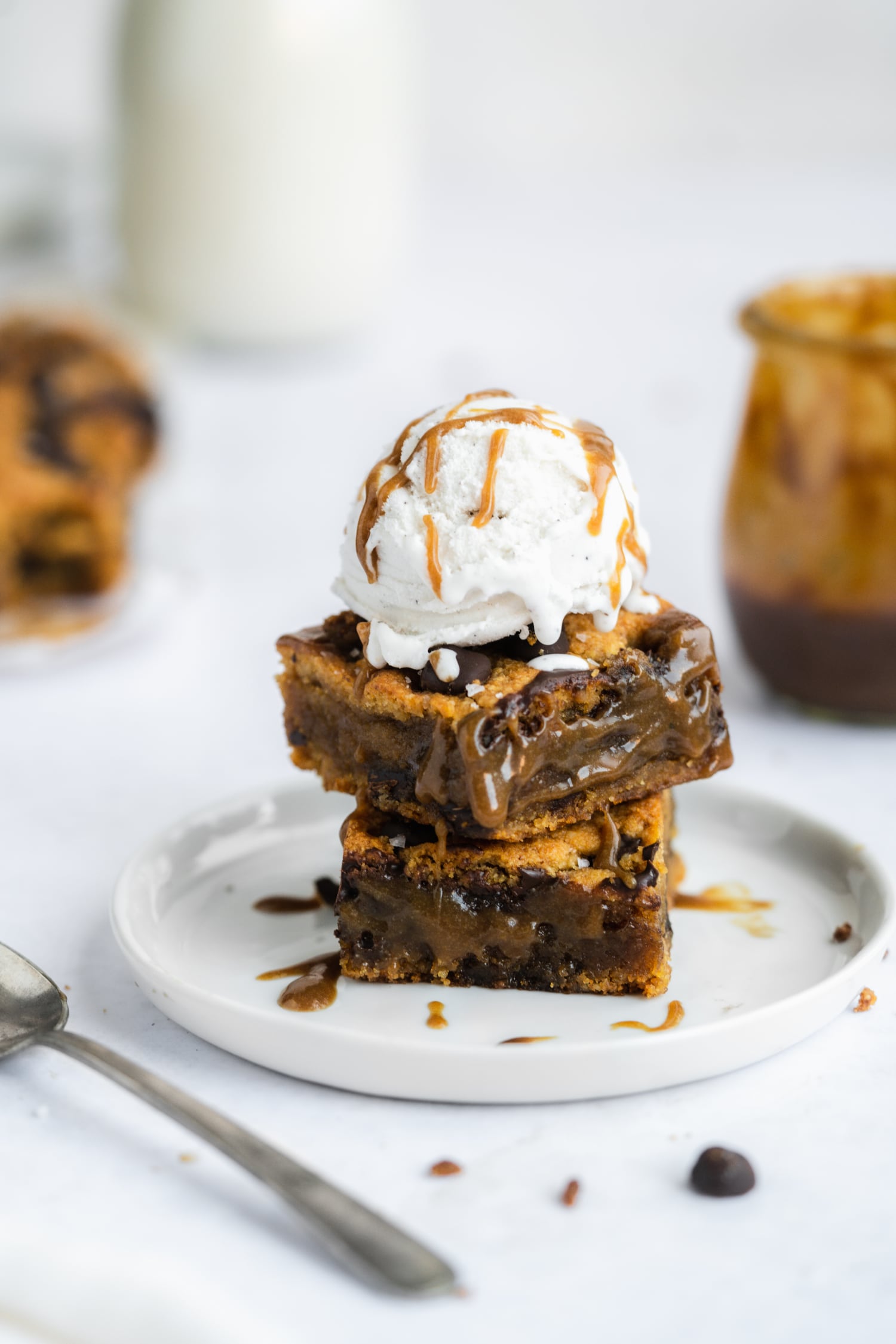 paleo salted caramel cookie bars with ice cream on top