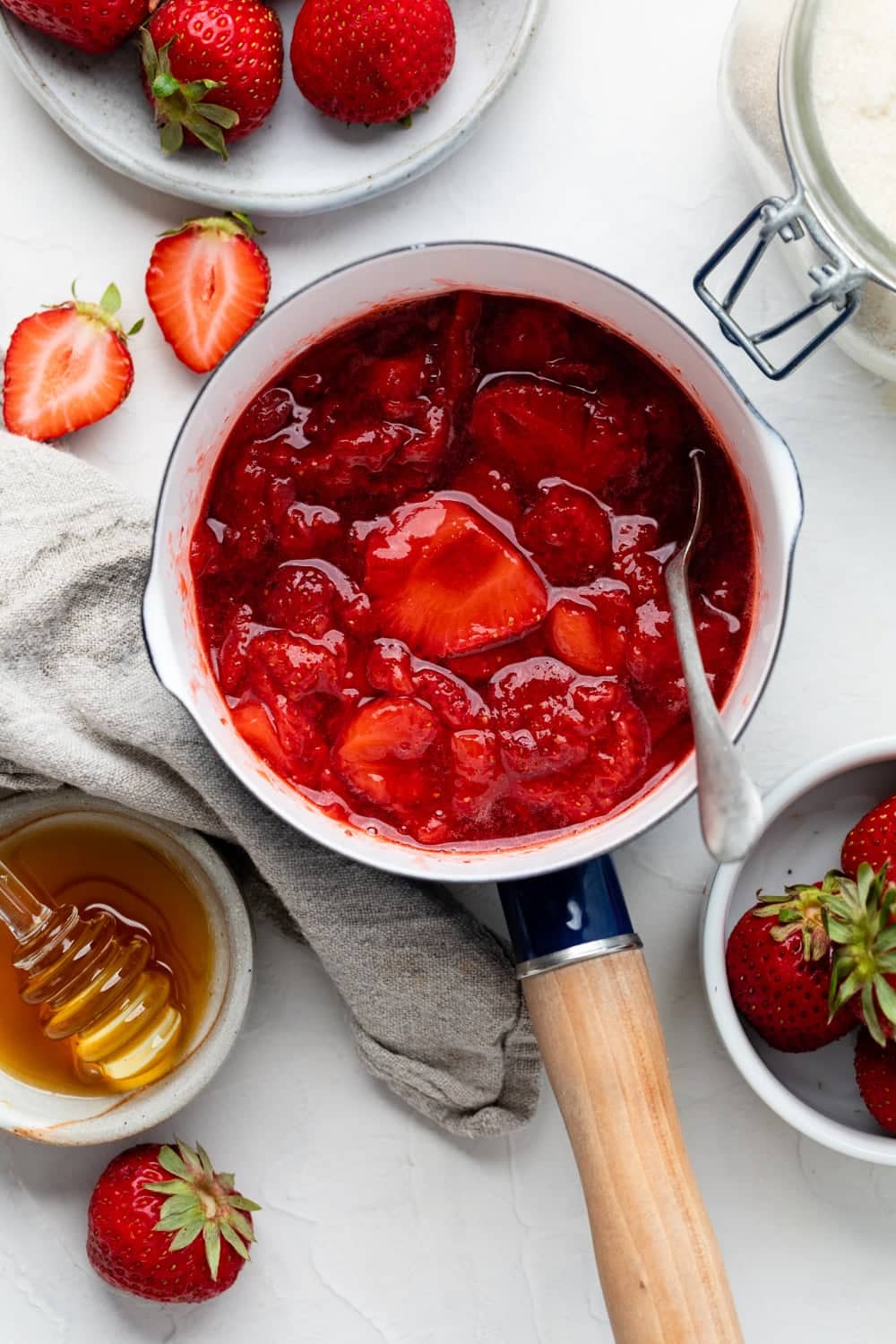 Making the strawberry sauce in a pot. 