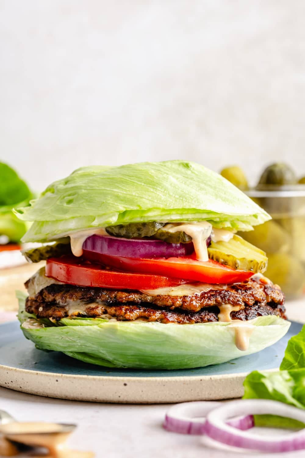 A smash burger made with ground turkey wrapped up in lettuce as a high protein option.